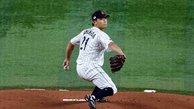 Mar 21, 2023; Miami, Florida, USA; Japan starting pitcher Shota Imanaga (21) pitches against the USA in the first inning at LoanDepot Park. Mandatory Credit: Rhona Wise-USA TODAY Sports